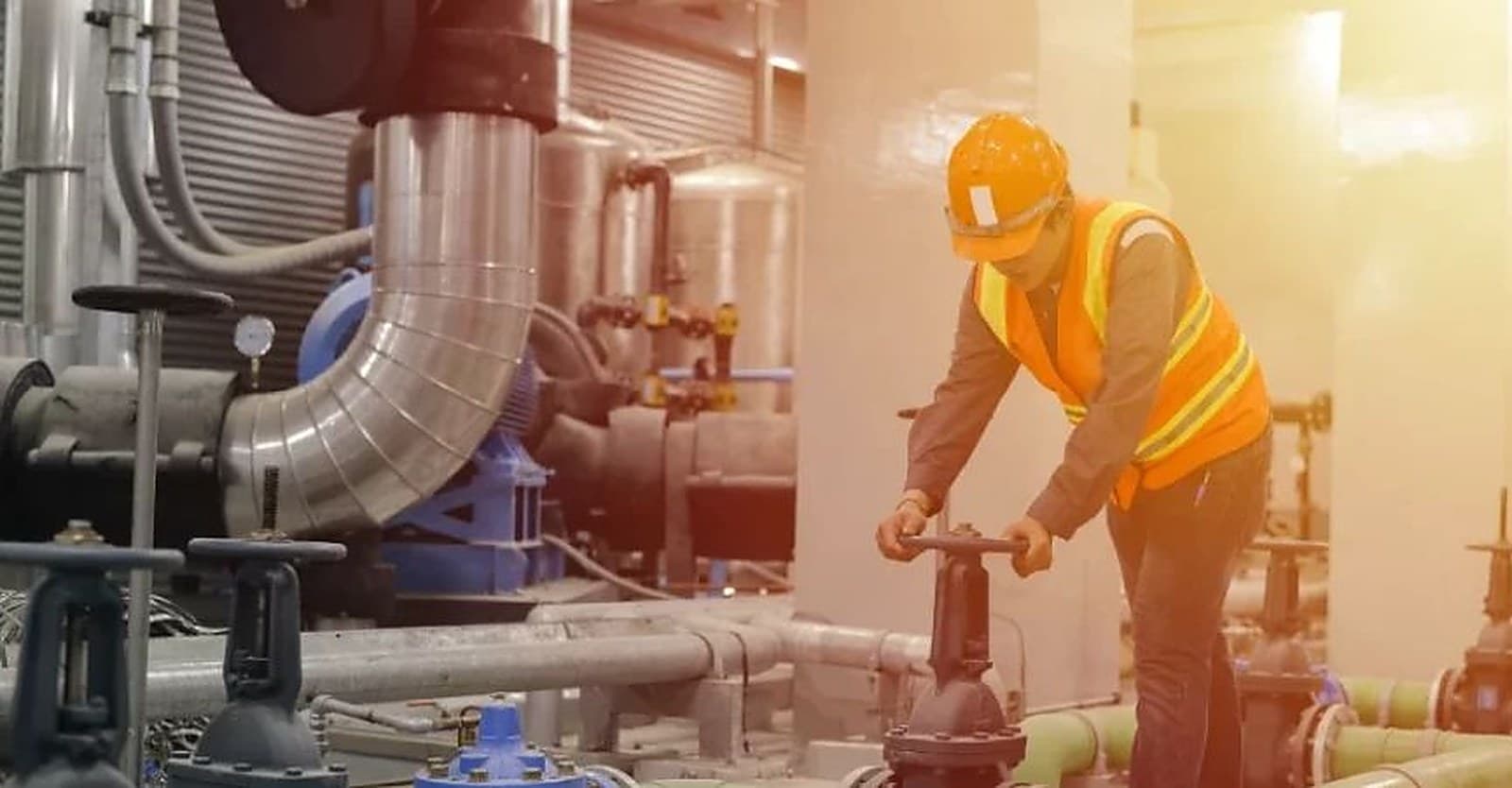AQUASTAG engineer verifying valve and pipework installation during plant commissioning